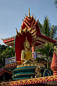 Vientiane, Laos - Pha That Luang, Other structures on the ground include a bell tower, several stupas, a number of pavilions sheltering images of the Buddha.  